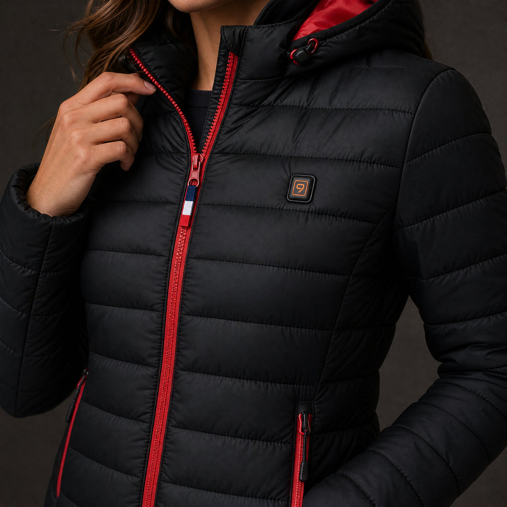 Doudoune femme Elara 5 : detail du bouton chauffant 9HEAT et de la fermeture rouge